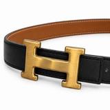 Hermès belt buckle detail on white background — AI-assisted studio image based on the actual item
