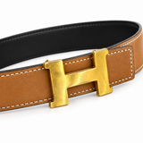 Hermès belt buckle detail on white background — AI-assisted studio image based on the actual item