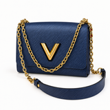 Louis Vuitton blue Epi leather bag with gold V closure - studio view