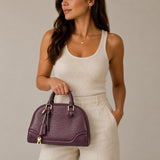 Louis Vuitton Alma Epi Leather Handbag I Plum, shown on model