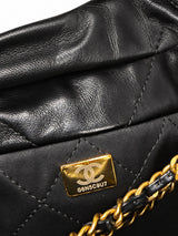 Chanel 22 bag black calfskin, back view with chain and leather shoulder straps